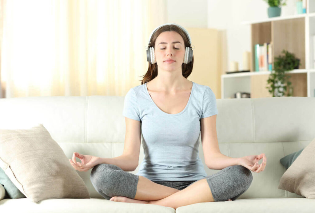 person listening quietly to guided audio meditation